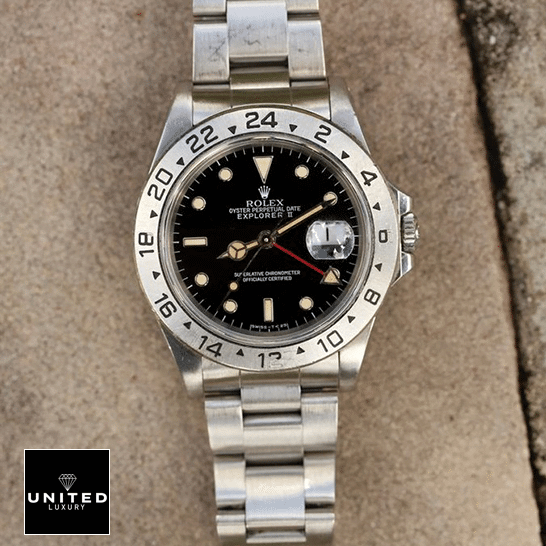 Vintage Rolex Replica 6 Rolex Explorer II 16570-0004 Stainless Steel Oyster Bracelet Replica on the table