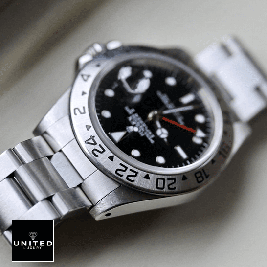 Vintage Rolex Replica 11 Rolex Explorer II 16570-0004 Stainless Steel Oyster Bracelet Replica on the table